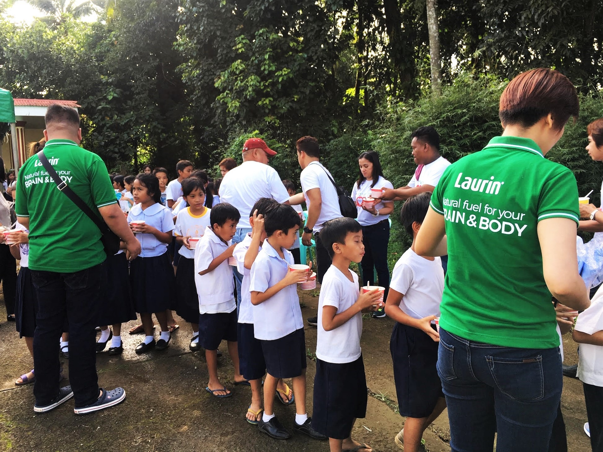 Staff assisting school kids in Lucban, Quezon